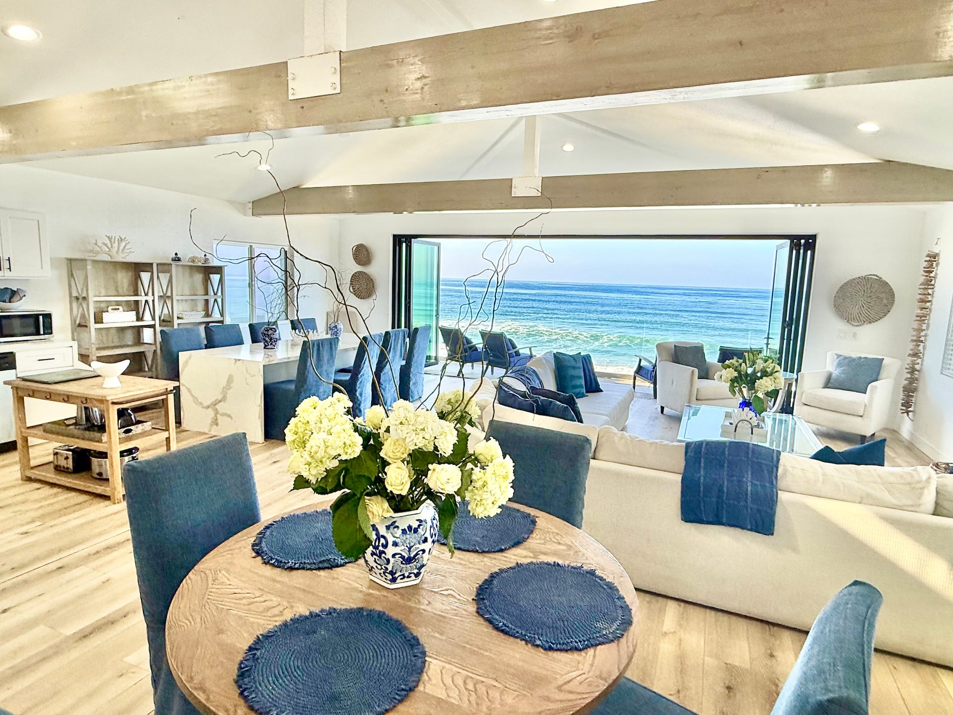 Dining table set for the group with the ocean beyond