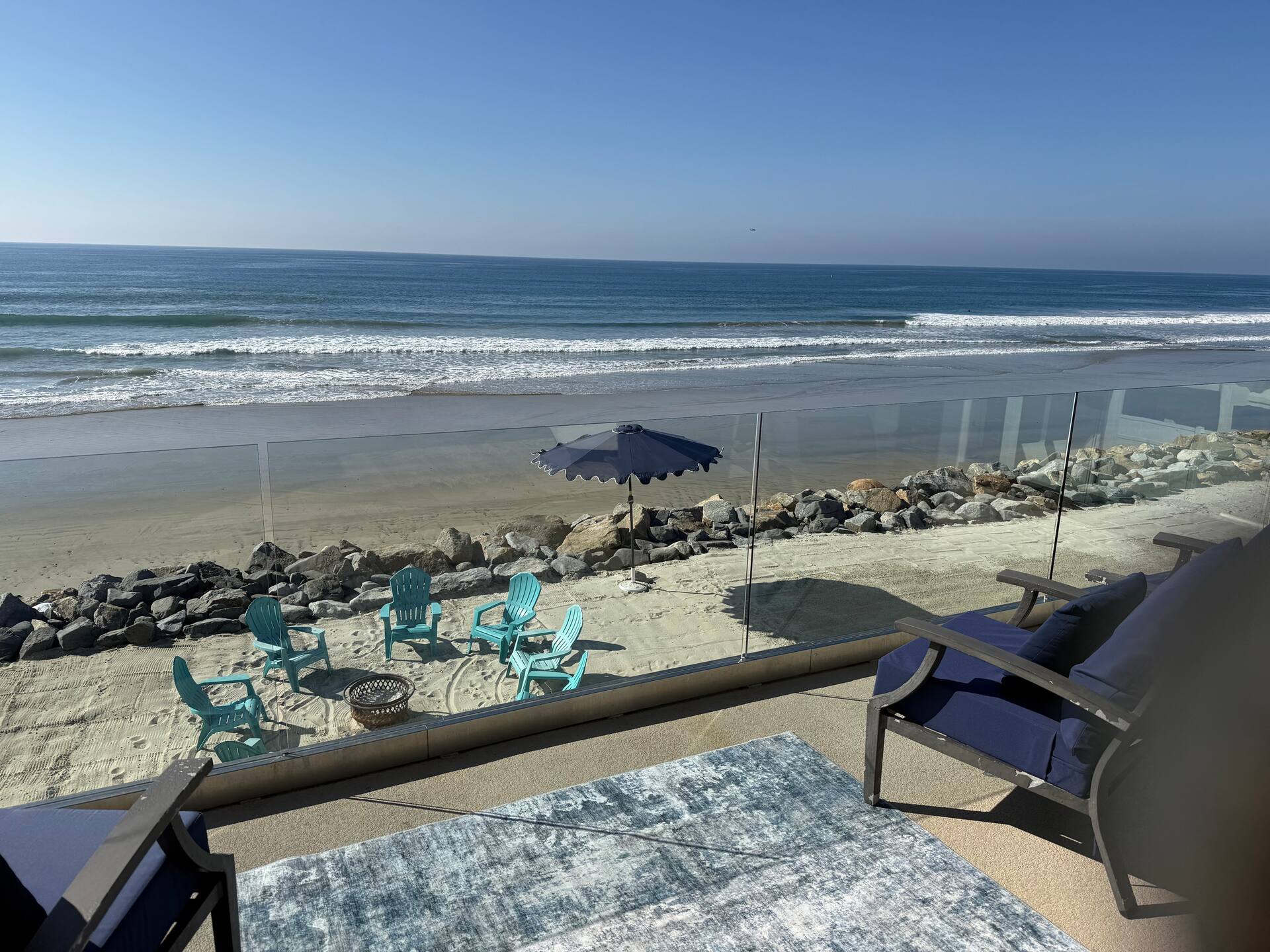 Ocean and beach view from the deck above the seawall